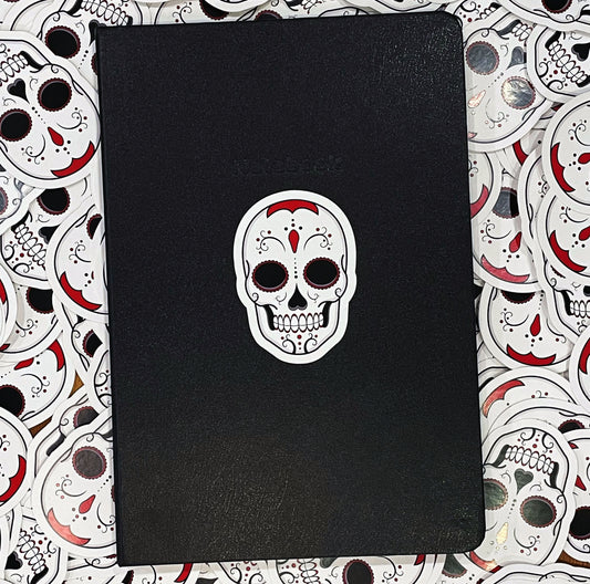 Vinyl Sticker on a notebook upon a layer of stickers